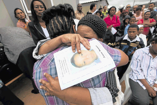 Family members grieve at the funaral of Anene Booysen who was brutally killed in Bredasdorp.