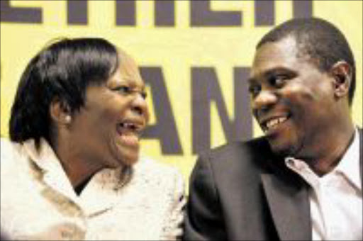 Incoming Gauteng Premier Nomvula Mokonyane and outgoing Gauteng Premier Paul Mashitile share a giggle during a press conference at the Gauteng Legislature, Tuesday 05 May 2009. Mokonyane will be sworn in as Premier tomorrow during a ceremony at the the legislature building in Johannesburg. PIC: HALDEN KROG. 05/05/2009. © SOWETAN