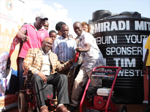 Westlands MP Tim Wanyonyi donates carwash equipment to Kangemi youth at Kihumbuini grounds yesterday /CHRISPINUS WEKESA