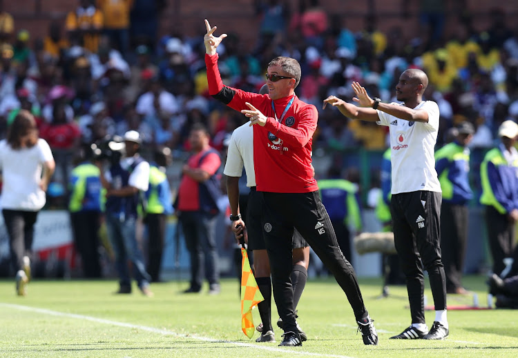 Orlando Pirates head coach Milutin Sredojevic (in red) barks out instructions to his players alongside his assistant Rhulani Mokwena during the Absa Premiership match against Mamelodi Sundownsa at Loftus Versveld Stadium, Pretoria South Africa on 13 January 2018.