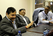 Indian businessmen Ajay and Atul Gupta, and Duduzane Zuma at the New Age Newspaper's offices in Midrand, Johannesburg, South Africa on 4 March 2011.