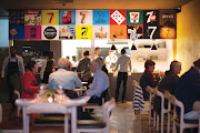 The interior of Seven, with funky graphic art featuring the lucky number 7.