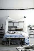 A cool colour palette creates a calm atmosphere in a bedroom.