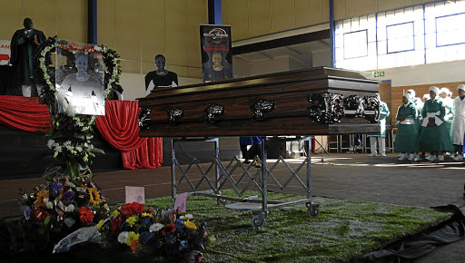 Thami Mbuyisa, the uncle of Nomsa Hilda Mbuyisa (inset), during her burial in Soweto at the weekend. The man who abused her has been arrested and charged with her murder.