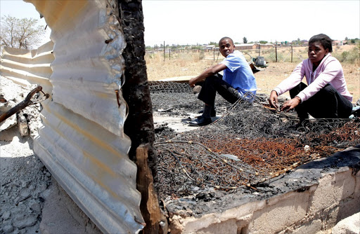 Thabang Mabotja, 16, and sister Noleen, 18, assess their loss after their shack caught fire on October 4. The orphans from Ga-Mabotja village in Moletji, Limpopo, are now homeless. Photo Sandile Ndlovu. © Sowetan
