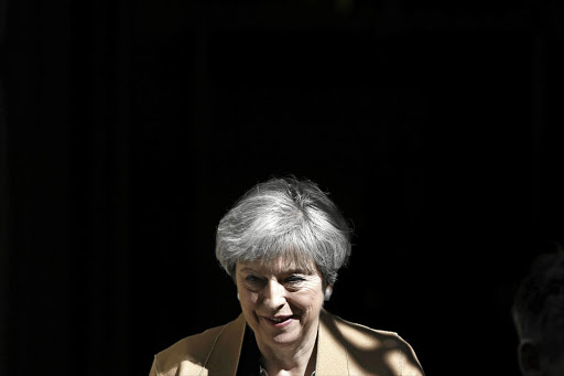 SURPRISE MOVE: Britain's Prime Minister Theresa May leaves 10 Downing Street on her way to the House of Commons. A Conservative election win would tighten May's grip on her party's Brexit ambitions.