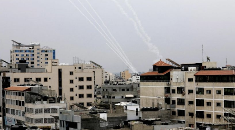 Rockets are launched from the Gaza Strip toward Israel.