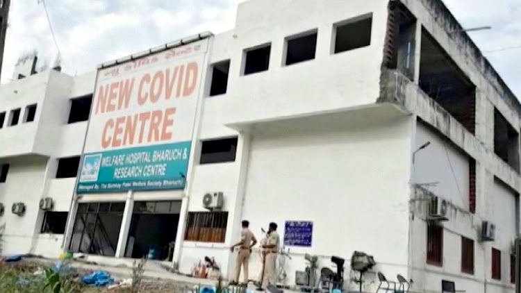 A sign reading "New Covid Centre, Welfare Hospital Bharuch & Research Centre" is seen at a the hospital, which was treating coronavirus disease (COVID-19) patients, after a deadly fire, in India's western Gujarat state, May 1, 2021, in this still image obtained from video.