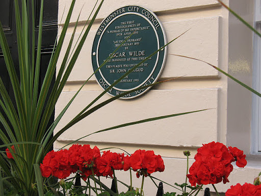 The plaque on the rear of the Theatre Royal records that Wilde's plays "a woman of no importance" and "an ideal husband" were first performed here. For context see TQ2980 : Suffolk Street,...