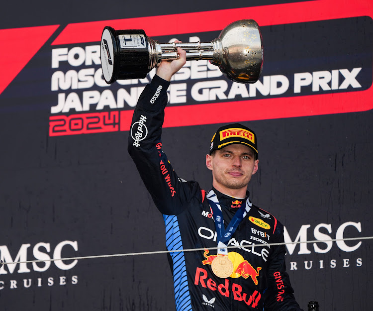 Red Bull driver Max Verstappen of the Netherlands celebrates during the awarding ceremony for the Formula One Japanese Grand Prix at the Suzuka Circuit in Suzuka, Japan, April 7