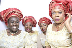 Ladies dressed in traditional attire celebrating at a corporate event