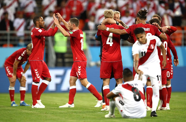 Denmark team celebrate following the 2018 FIFA World Cup Russia group C match between Peru and Denmark at Mordovia Arena on June 16, 2018 in Saransk, Russia.