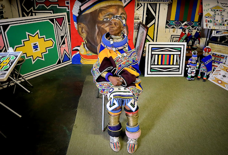 World renowned African artist Mam' Esther Mahlangu poses for a portrait in her art studio which houses some of the artwork she's made over the years.