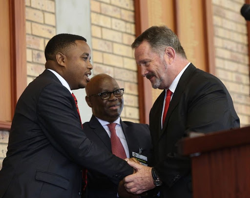 KZN MEC for Education Mthandeni Dlungwane shakes hands with Chris Lyman the Headmaster of Maritzburg College after addressing matrices before their first final exam Picture : Jackie Clausen