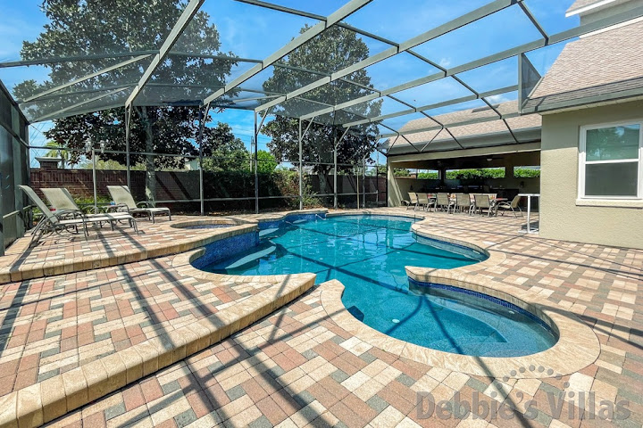 Spacious sun-drenched pool and spa deck at this Formosa Gardens vacation villa