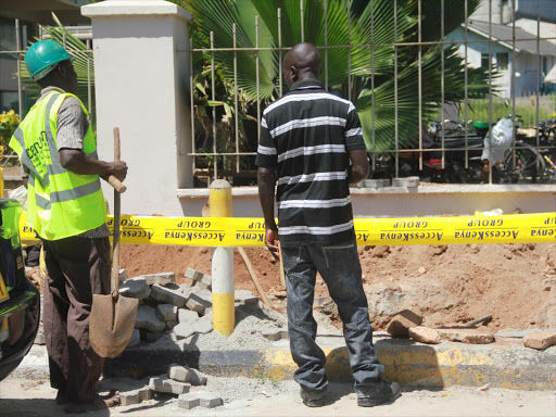 Access Kenya workers laying internet cables along Nkrumah road Mombasa on 11th November, 2013. /Elkana Jacob