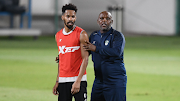 Coach Pitso Mosimane with an Al-Ahli player during his first training session at the club.