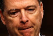 Former FBI Director Comey testifies before a Senate Intelligence Committee hearing in Washington.