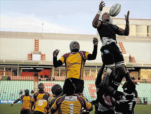 GOING AIRBORNE: Walter Sisulu University’s Luyolo Fata goes high to try and secure the ball against Mangosuthu University yesterday Picture: MARK ANDREWS