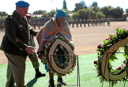 SOLDIER'S SACRIFICE: Masechaba Mokhothu lays a wreath for her son Albert, a soldier killed on a UN mission in the DRC last year, during the International Day for UN Peacekeepers, in Bloemfontein yesterday.