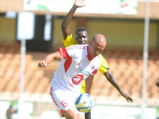 AS Port Louis’ Christopher Bazerque shields ball from Tusker FC’s Humprey Mieno. /ENOS TECHE