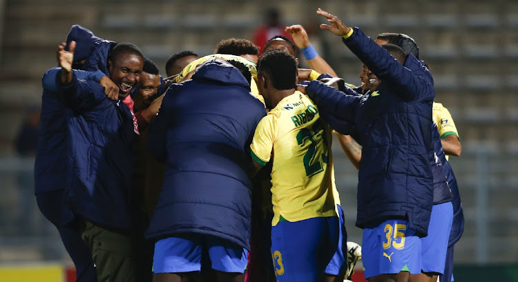 Mamelodi Sundowns coach Rulani Mokwena (left) and his players celebrate their penalties victory in their Nedbank Cup quarterfinal against University of Pretoria FC at Lucas Moripe Stadium on Friday.