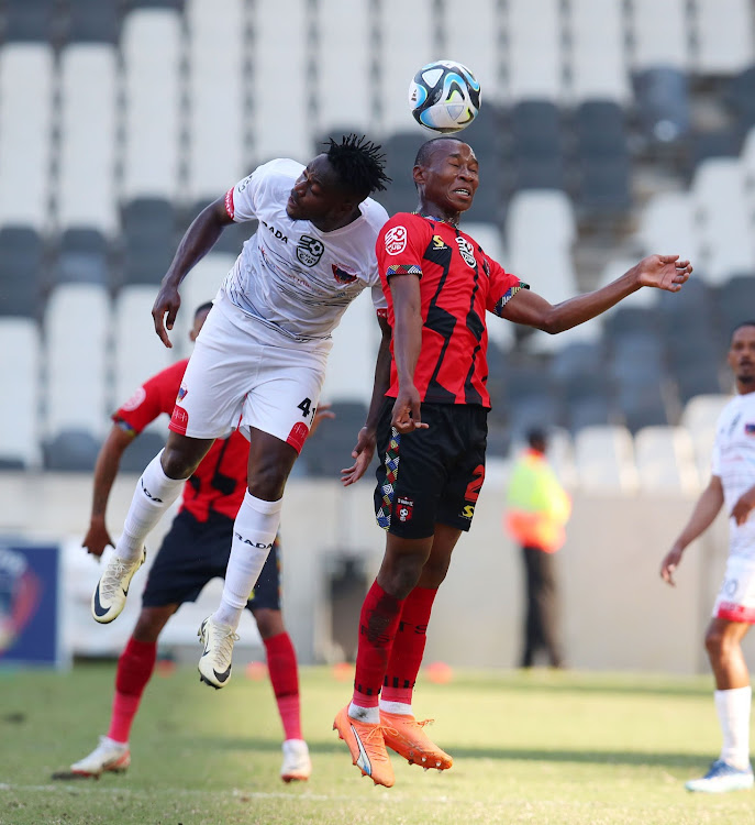 Samukelo Kabini of TS Galaxy is challenged by Bienvenu Eva Nga of Chippa United during the Nedbank Cup quarterfinal at the Mbombela Stadium on Sunday