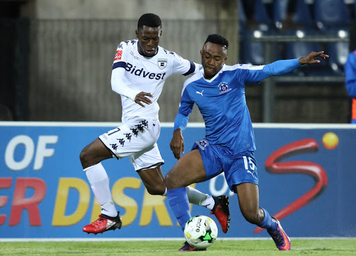 Phakamani Mahlambi of Bidvest Wits challenges Lebohang Maboe during the Absa Premiership match between Maritzburg United and Bidvest Wits at Harry Gwala Stadium on December 20, 2016 in Durban, South Africa.