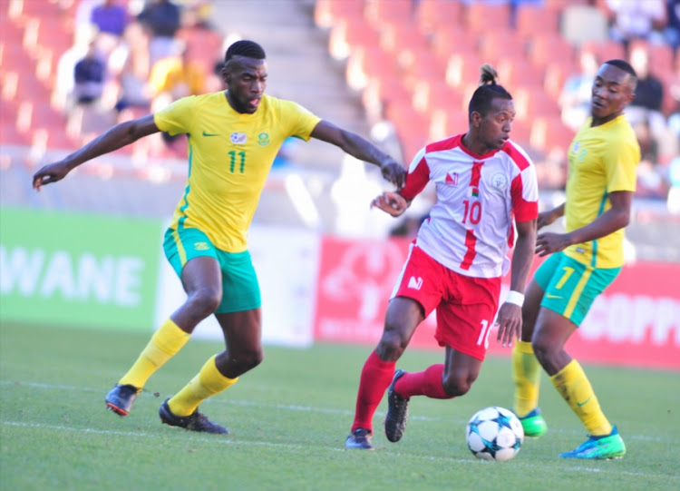 Andriamirado Hasina of Madagascar and Matlhari Makaringe of South Africa during the 2018 COSAFA Cup quarter final match between South Africa and Madagascar at Old Peter Mokaba Stadium on June 03, 2018 in Polokwane, South Africa.