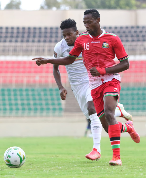 Harambee Stars' forward Masud Juma contests for the ball with Enock Walusimbi of Uganda Cranes in a past match