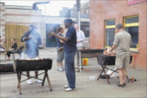 A MAN'S WORLD: The braai stand remains a hotly guarded men's domain but sometimes the feminine touch can do wonders there too. © Unknown.