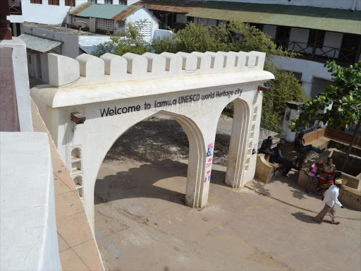A Unesco message is inscribed on the main gate into Lamu old town.