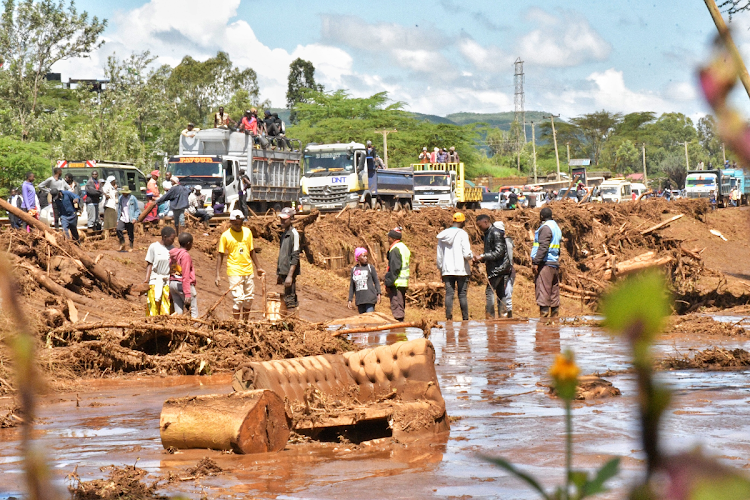 Members of the public at the scene of the dam which burst killing tens in Mai Mahiu, Naivasha