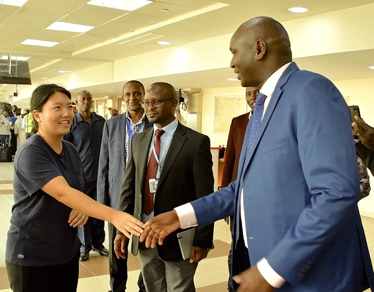Immigration PS Julius Bitok meets Ms Kyung Sang Yoo, who was among the first visa-free travellers to Kenya.