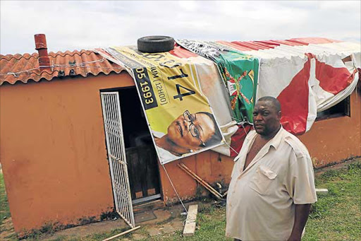February 24,2017. Andries Magwaxaza of NU10 Mdantsane seen here at his home after the storm damege, and he was only given banners by the Municipality to cover his Home : MICHAEL PINYANA © DAILY DISPATCH