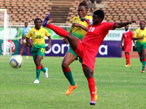 Elizabeth Ambogo controls the ball from Cameroon’s Prudence Andiolla. / ENOS TECHE