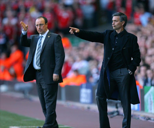 A file photo of then Liverpool's Spanish manager Rafael Benitez (L) and Chelsea's Portuguese manager Jose Mourinho give instructions to their players during their European Champions League semi final second leg football match at Anfield, Liverpool, north west England, 01 May 2007.