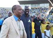 Mamelodi Sundowns billionaire owner-president Patrice Motsepe celebrates with fans after his team won the league championship. 