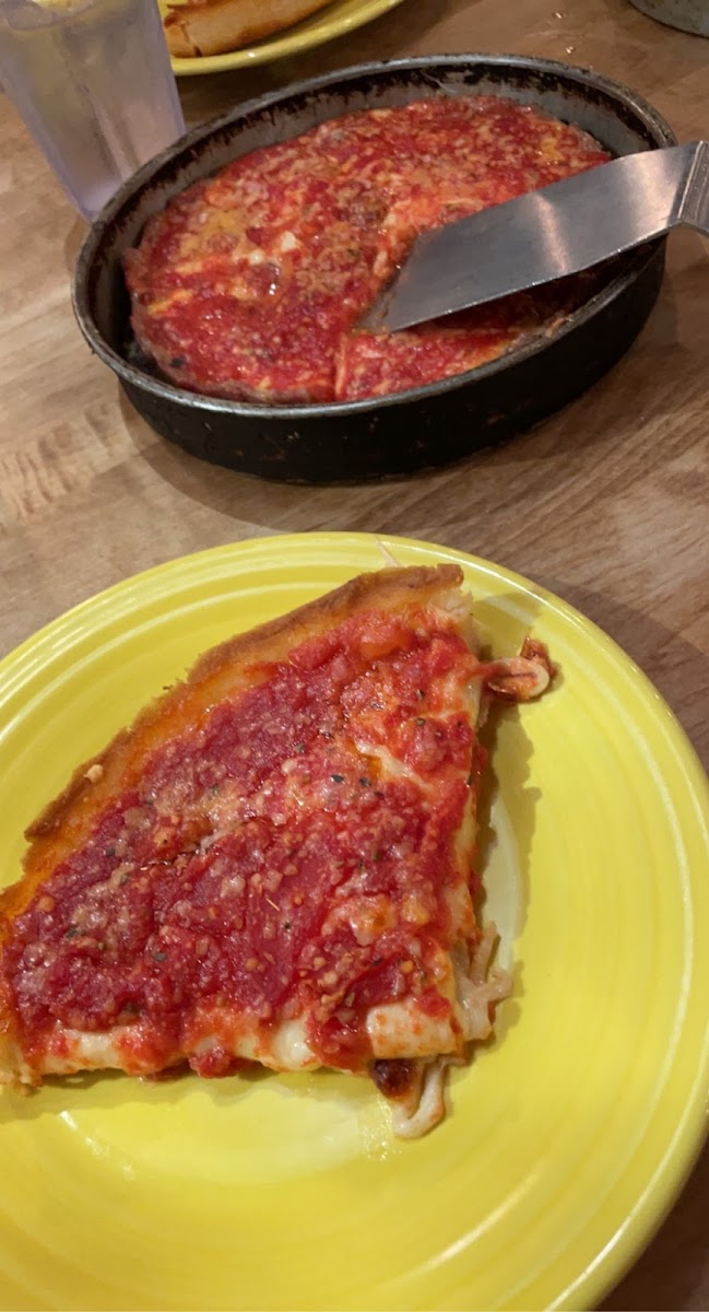 the gluten free deep dish (on the yellow plate) and the crustless deep dish (in the pan)
