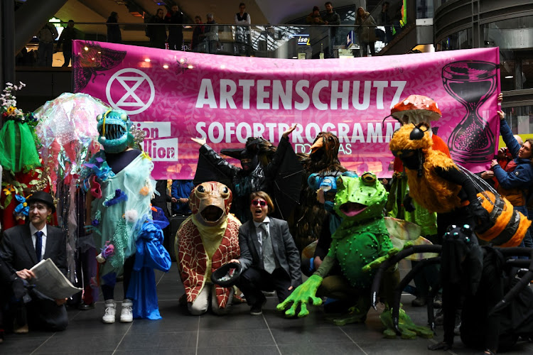 Supporters of the environmental movement Extinction Rebellion demonstrate against the extinction of species in Berlin, Germany, on April 15 2023. The banner reads: ‘Immediate programme for species protection.’ Picture: REUTERS/CHRISTIAN MANG