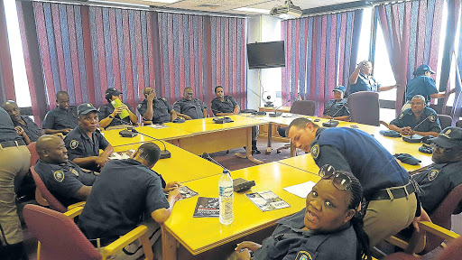 RED TAPE SPIN: BCM law enforcement officer stage a sit-in protest at the Trust Centre yesterday Picture: MARK ANDREWS