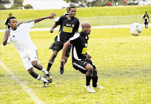 WATCHFUL EYE: Sinethemba Mkunqwana of Future Tigers competes with Mallo James and Thobile Mkize of Tornado for the ball. Tornado play FC Elliot today Picture: STEPHANIE LLOYD