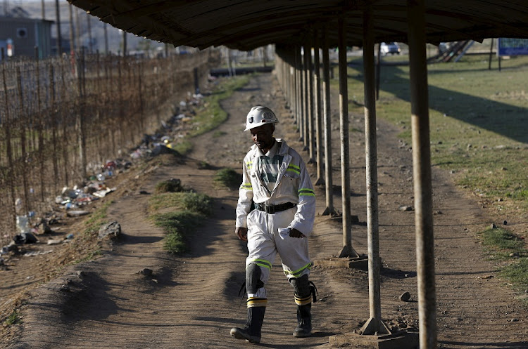 A mine worker returns from the Lonmin mine at the end of his shift, outside Rustenburg. Picture: REUTERS/SIPHIWE SIBEKO