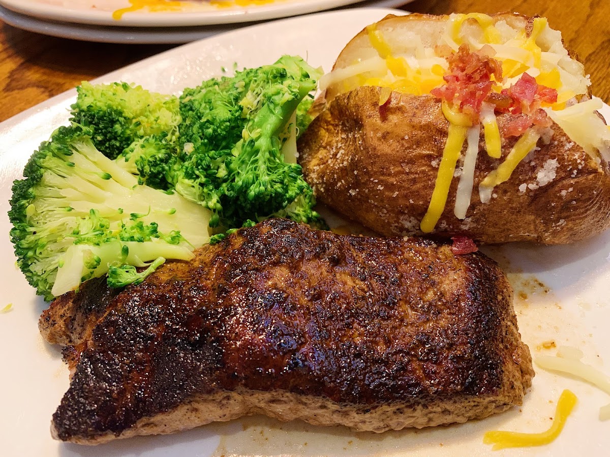 Outback sirloin, loaded baked potato, and broccoli