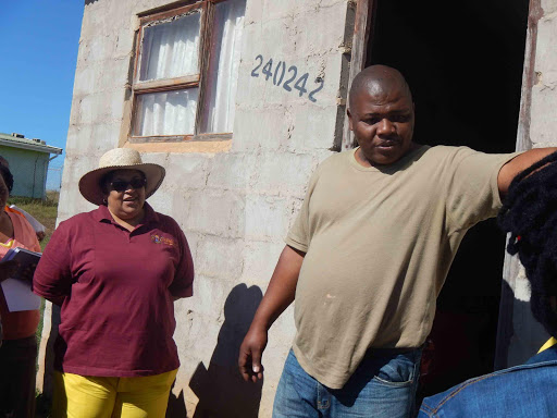 IT’S MY HOUSE: Mpendulo Dingiso during human settlements MEC Helen Sauls-August’s visit Picture: SIKHO NTSHOBANE