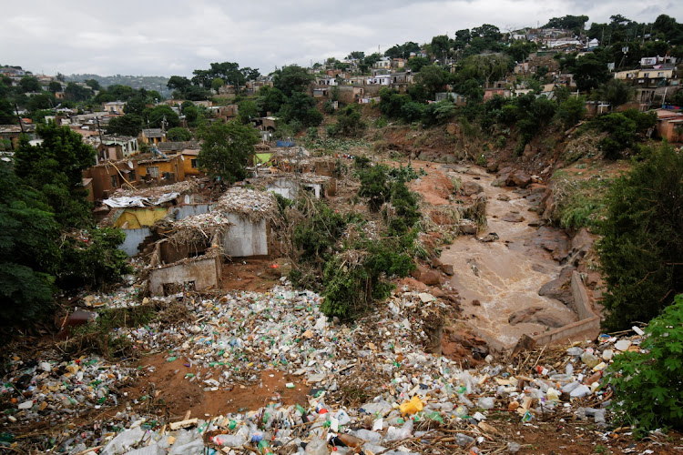 Destroyed homes and rubbish are seen after a river burst its banks in Ntuzuma, Durban, South Africa, April 13, 2022. REUTERS/Rogan Ward