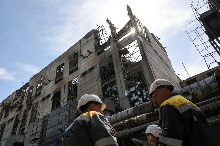 Thermal power plant employees at the building damaged by recent Russian missile strikes in Ukraine, May 2 2024. Picture: REUTERS/ROMAN BALUK