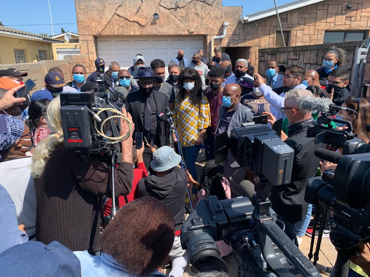 Police minister Bheki Cele addresses the media alongside Lt-Col Charl Kinnear's wife, Nicolette, a day after the detective was shot dead on September 18 2020 outside his home in Bishop Lavis, Cape Town.
