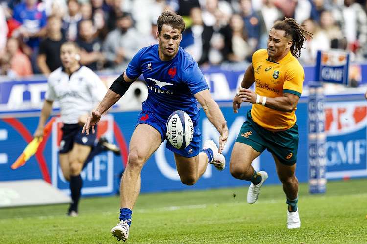 Damian Penaud of France chases the ball against Issak Fines-Leleiwasa of Australia in their Summer Nations Series Test on August 27 2023. Picture: ANTONIO BORGA/EURASIA SPORT IMAGES/GETTY IMAGES