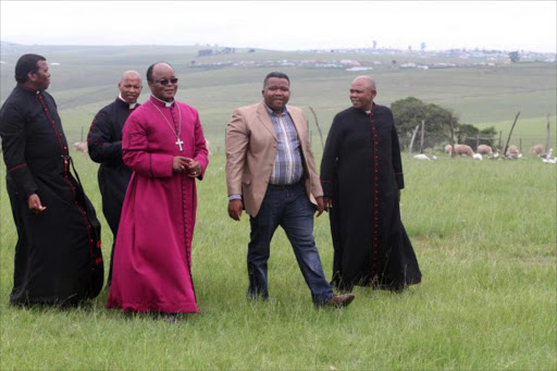 GREETINGS: The new Anglican Church’s Mthatha Diocese Bishop, Dr Nkosinathi Ndwandwe, third from left, pays a courtesy visit to Western Mpondoland King Ndamase Ndamase, fourth left, at Nyandeni Great Place near Libode Picture: LULAMILE FENI